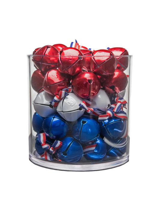 Clear glass container filled with red, white, and blue jingle bells on a white background