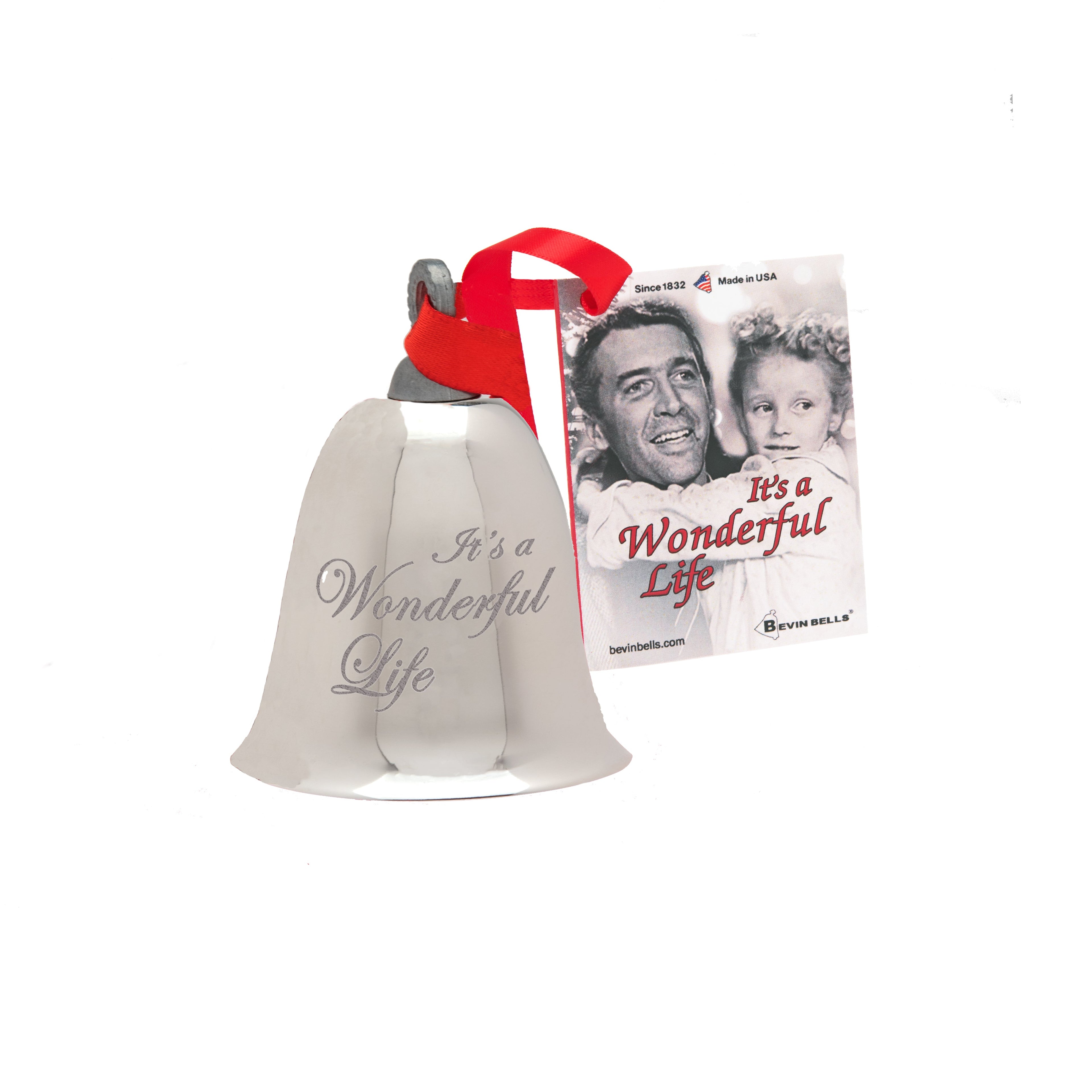 Decorative bell with 'It's a Wonderful Life' text and a small card featuring a classic movie scene on a white background.