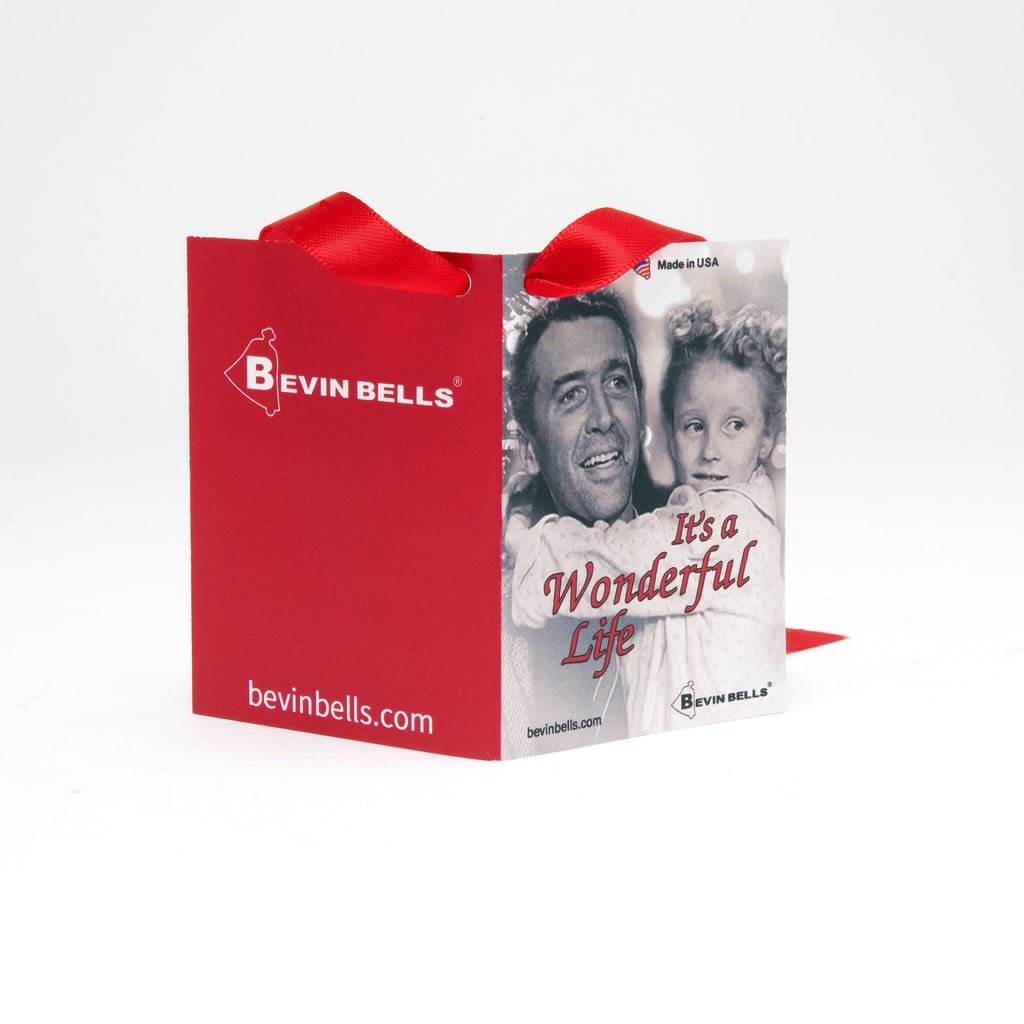 Red gift bag with 'Bevin Bells' branding and a photo of a man and child on a white background
